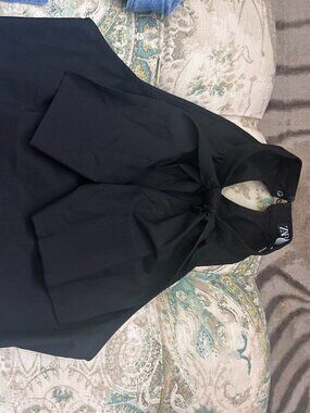 Black Zara halterneck top featuring a prominent front knot and bow detail